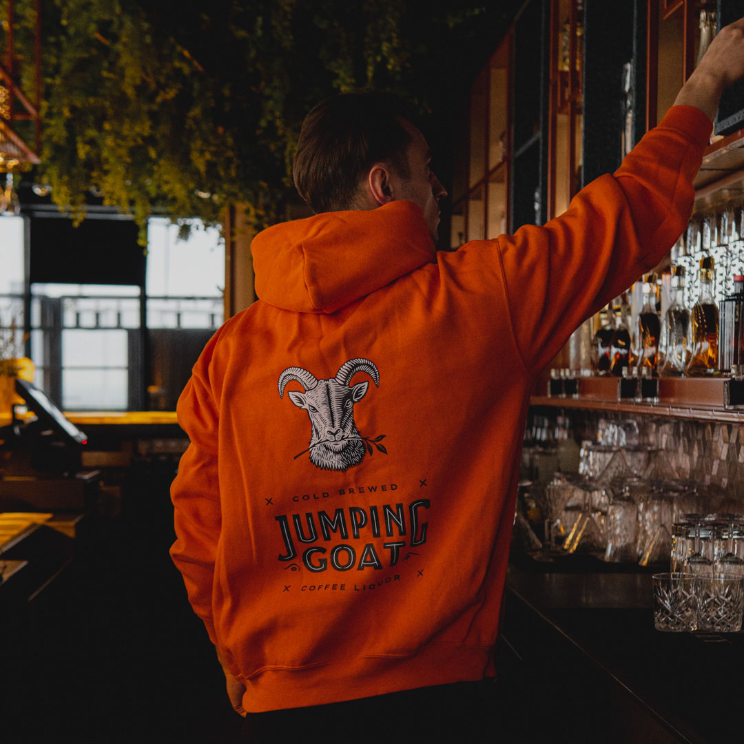 orange hoodie jumping goat