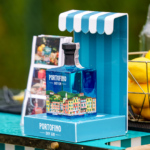 bottle of Portofino gin in a branded striped display stand