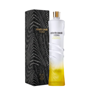White bottle of Roberto Cavalli Vodka with a yellow gradient at the bottom, pineapple flavor, next to a box.