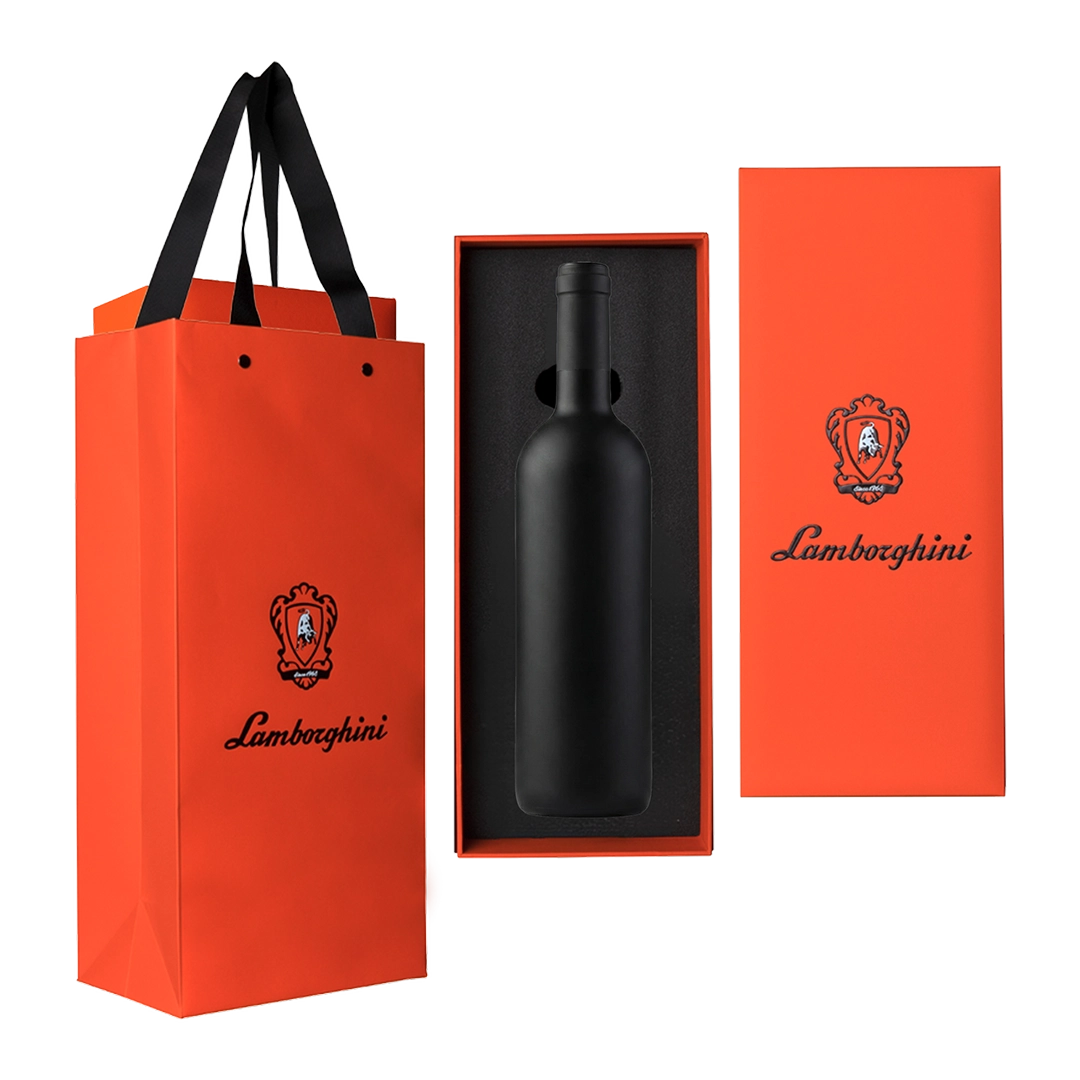 Pomarańczowa torba i pudełko prezentowe z logo Lamborghini, zawierające matową, czarną butelkę wina spokojnego