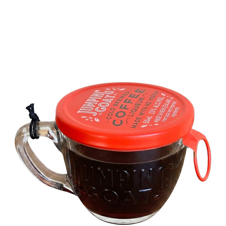 A miniature clear cup with a red lid containing a 50 ml shot of Jumping Goat coffee liqueur