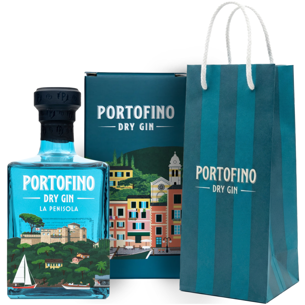 A blue bottle of limited edition Portofino La Penisola gin featuring an illustration of a castle on a wooded peninsula, next to a decorative box and a striped gift bag.