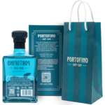 The back of the Portofino La Penisola gin bottle and box, showing limited edition details, volume, and alcohol content, next to a blue striped bag