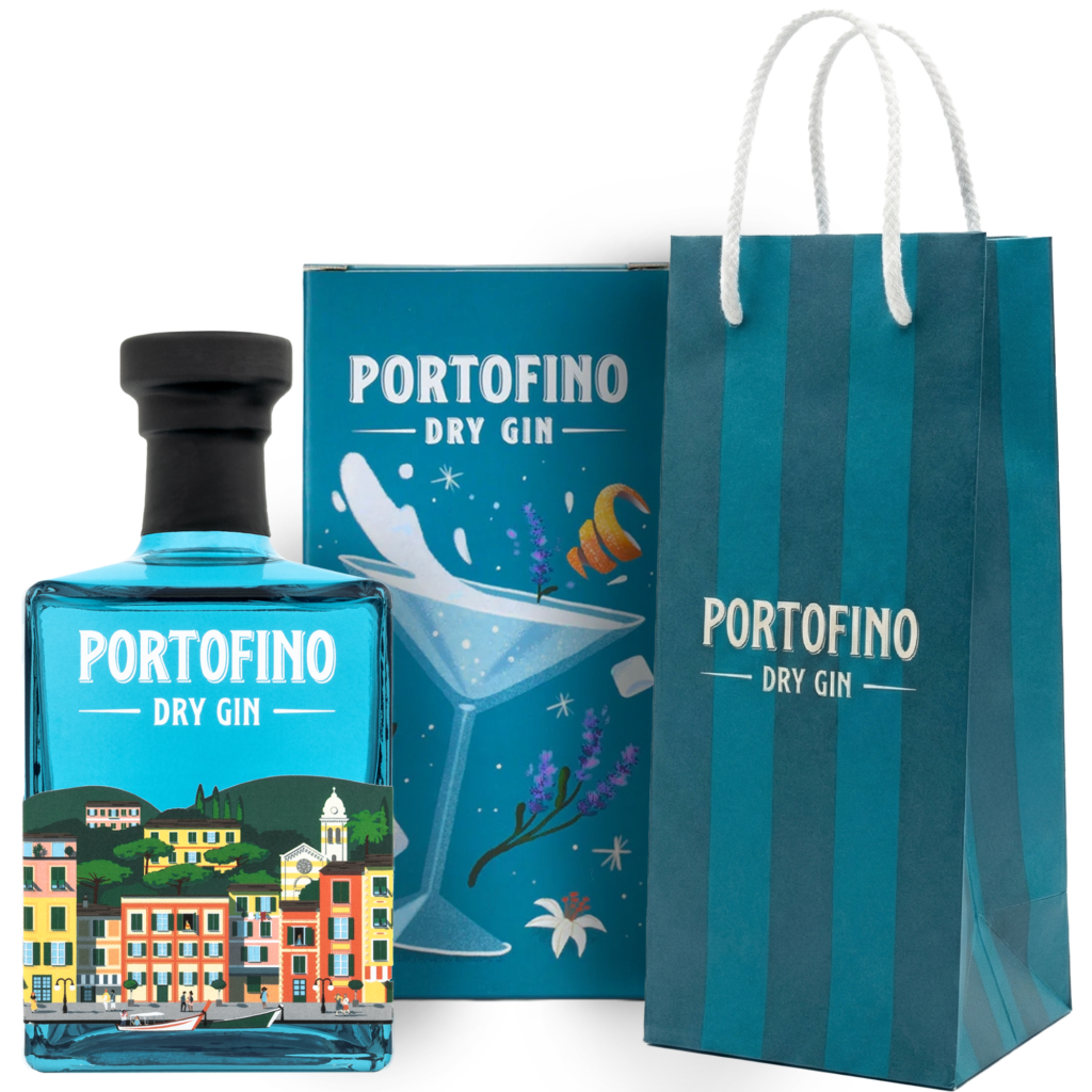 a blue Portofino gin bottle in front of a box featuring an illustration of a martini glass, lemon peel, and lavender. Next to it is a blue gift bag.
