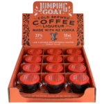 Display box filled with Jumping Goat Cold Brewed Coffee Liqueur 50ml mini cups made with NZ vodka