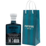 Tył butelki Portofino Dry Gin Winter Nights Limited Edition 500 ml z etykietą 43% alkoholu, obok firmowa torba Portofino